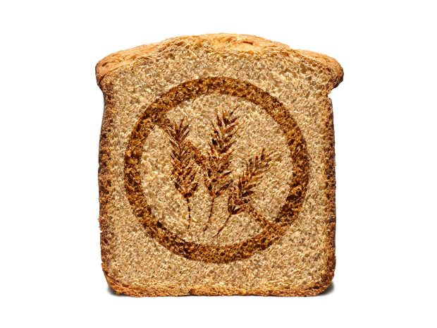fetta di pane con disegnato il simbolo del divieto e le spighe di grano